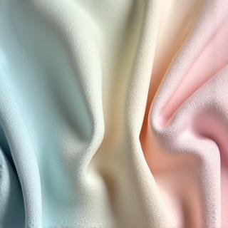 Muestras de tejidos de algodón orgánico de colores suaves.